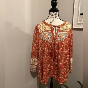 Lightweight tunic with orange and cream designs.